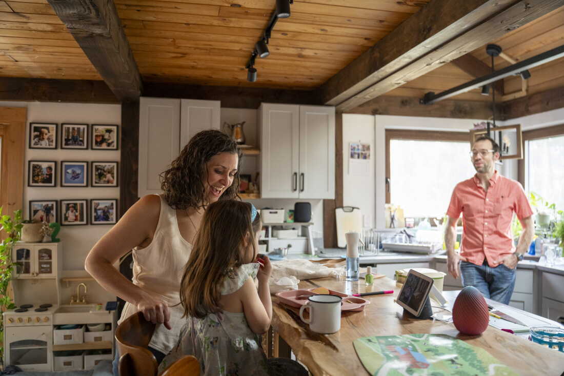 Meghan Lena, her husband, Eric Schimelpfenig, and their daughter at home in Bernardston, Mass.