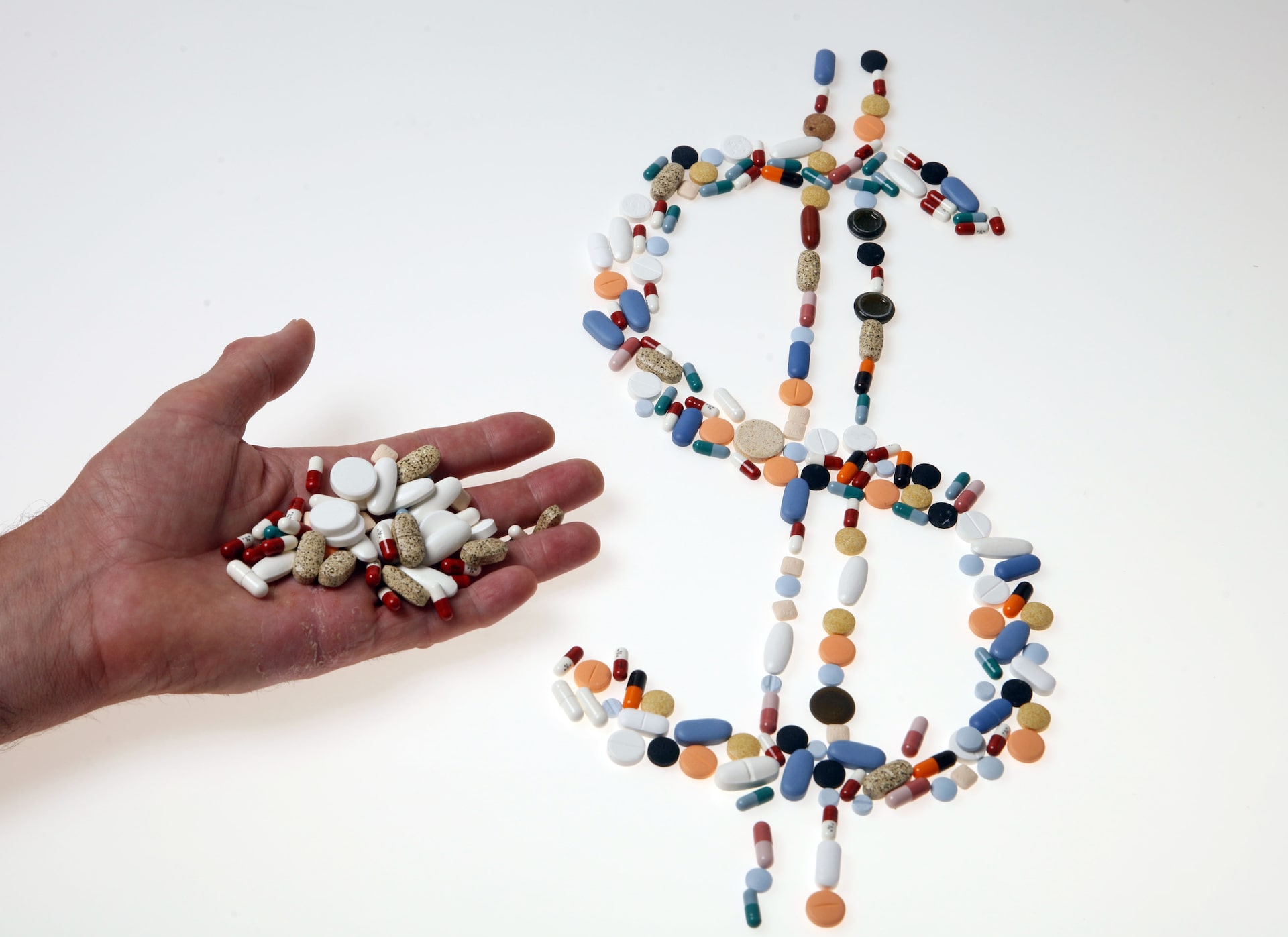 Pharmaceutical tablets and capsules are arranged on a table in this picture illustration taken in Ljubljana